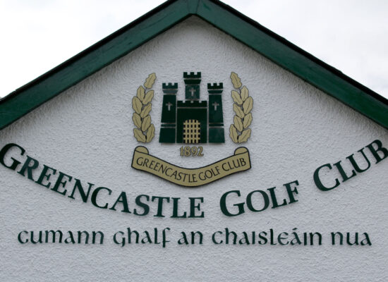 Greencastle Golf Club sign with castle crest, est. 1892, and Irish name Cumann Ghalf an Chaisleán Nua.